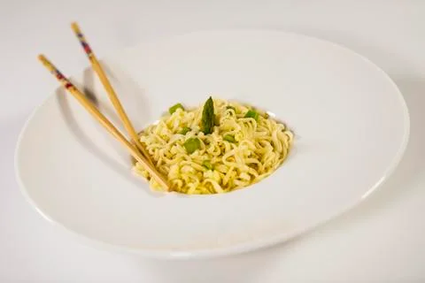 Select focus and close up of an appetizing plate of pasta with asparagus with Stock Photos