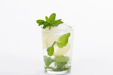 Select focus and close up of an appetizing looking mojito cocktail on a light Stock Photos