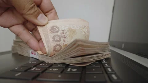 Select focus of a lot of thousands Thai baht banknotes money. Stock Footage 236014595