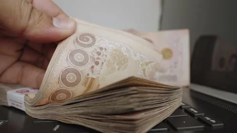 Select focus of a lot of thousands Thai baht banknotes money. Stock Footage 236014619