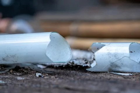 The select focus Pile of broken fluorescent light bulb is danger for health w Stock Photos