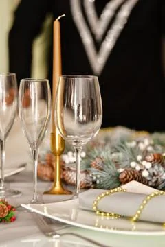 Select focus of several glasses surrounded by beautiful Christmas decorations Stock Photos