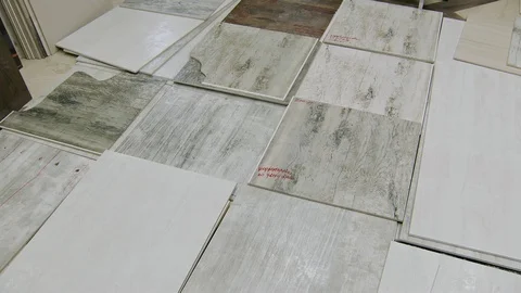 Selected ceramic tiles are lying on floor in warehouse, panoramic view Video stock 104836403