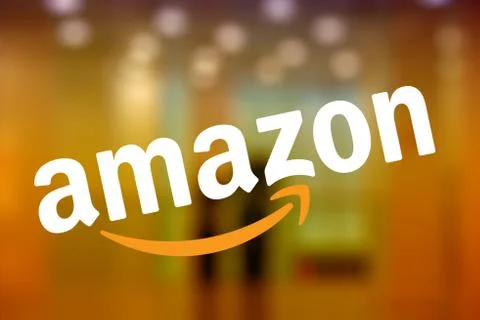 Selected Focus on the Amazon logo displayed on the window of an Amazon bookst Stock Photos