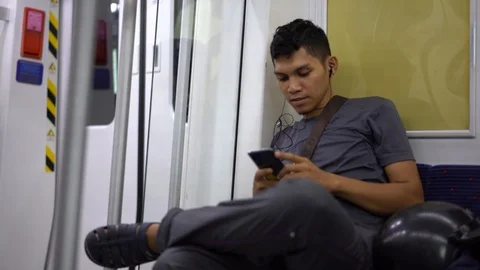Selected focus on an asian man looking at the mobile phone Video stock 110993222