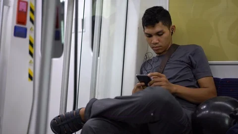 Selected focus on an asian man looking at the mobile phone Video stock 110996930