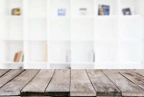 Selected focus empty old wooden table and .Library or Bookstore blur backgrou Stock Photos