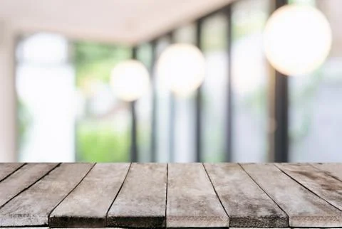 Selected focus Empty wooden table and blurred background of abstract in front Stock Photos