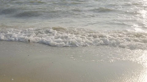 Selected Focus Foam Wave of Water Sea Ripple to the Clear Sandy Beach Stock Footage 128672118