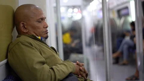 Selected focus on an old man sleeping in the train Video stock 111000921