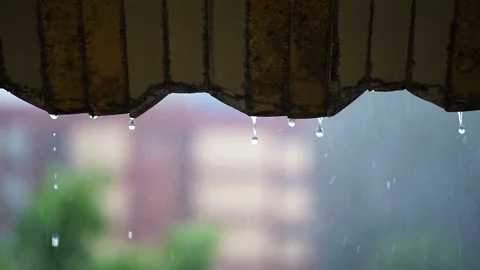 Selected focus: rainwater dripping through the roof with a blurred background Stock Footage 142306972