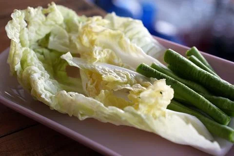 Selected focus Vegetable side dishes on pink disk and blurred paper backgroun Stock Photos