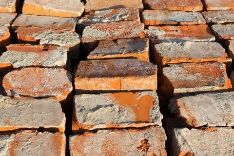 Selected red bricks. Reuse of bricks for the construction of a new house. Stock Photos