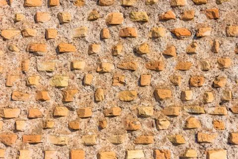 Selected stones in the wall, the texture of the ancient pattern. Stock Photos