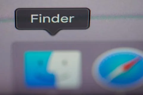 Selecting finder application on computer Stock Photos