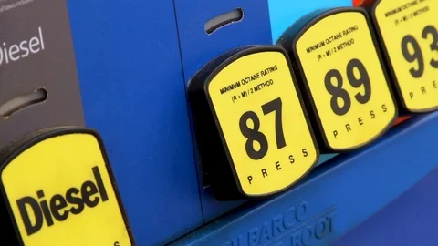 Selecting fuel grade at a gas pump Stock Footage 89241450