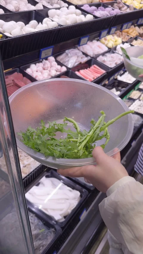 Selecting Hot Pot Ingredients at Buffet Counter Stock Footage 323493499