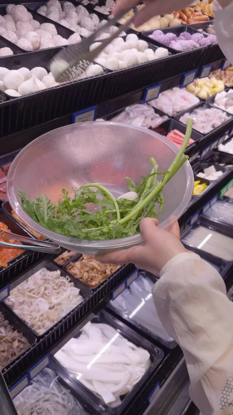 Selecting Hot Pot Ingredients at Buffet Counter Stock Footage 323493543