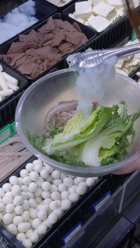Selecting Hot Pot Ingredients at Buffet Counter Video stock 323493575