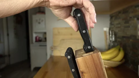 Selecting a knife while chopping and cooking in the kitchen Stock Footage 225760567