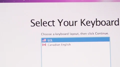 Selecting language preferences during setup on Apple iMac computer Stock Footage 103877982
