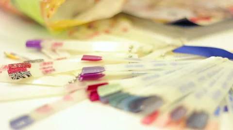 Selecting a manicure example in a beauty salon Stock Footage 58960845