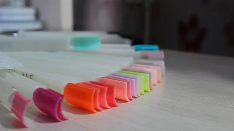 Selecting a manicure example in a beauty salon Stock Footage 63458069