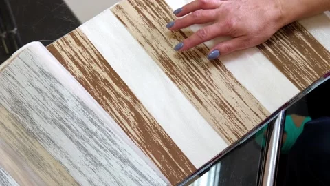 Selecting paint colors for window blinds. Repair and construction Stock Footage 249926747