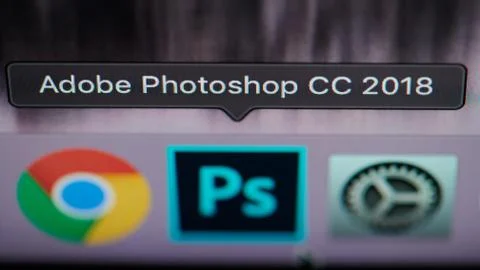 Selecting photoshop application on computer Stock Photos