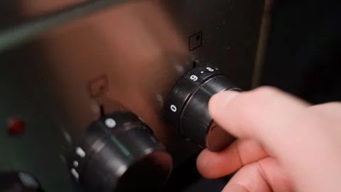 Selecting the power of an electric stove, close-up Stock Footage 324181816