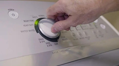 Selecting program settings and starting washing machine. Video stock 116915447