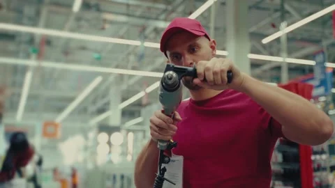 Selecting the right drill in a home improvement store for an upcoming project Stock Footage 293673593
