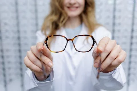 Selecting Stylish Glasses for Poor Vision in an Optics Store Stock Photos
