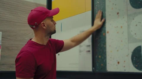 Selecting a tile design at a home improvement store for interior decoration Stock Footage 293672597