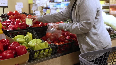 Selecting Tomatoes at Supermarket Vegetable Video stock 324568292