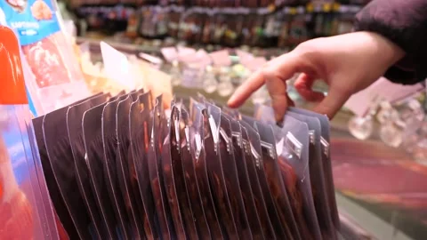 Selection and search on the store shelf of delicious sliced ​​meat products. Stock Footage 293495054