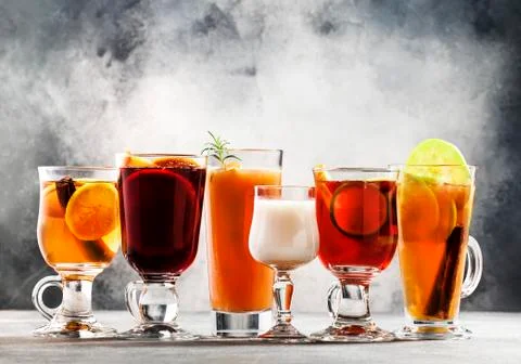 Selection of autumn or winter alcoholic hot cocktails - mulled wine, glogg, g Stock Photos