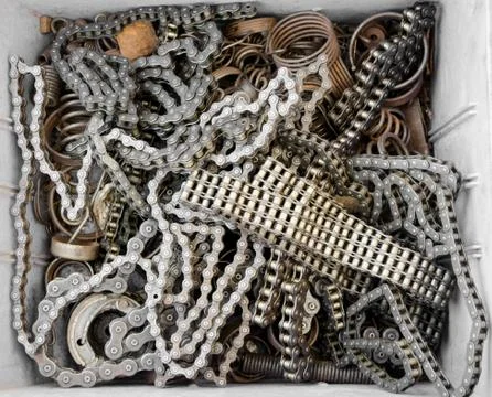 A selection of bicycle chains and some springs in a box Stock Photos