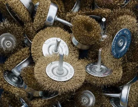 A selection of brass wire brushes for use with a drill Stock Photos