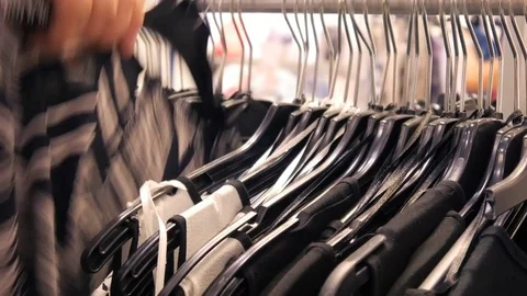 Selection of clothes in the store Видео 80025947