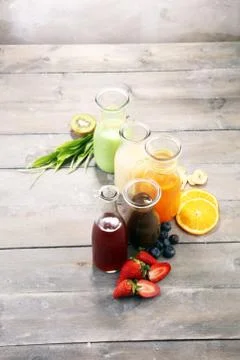Selection of colorful smoothies on rustic background Stock Photos