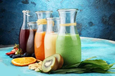 Selection of colorful smoothies on rustic background Stock Photos