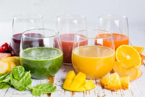 Selection of colourful smoothies on rustic wood background Stock Photos