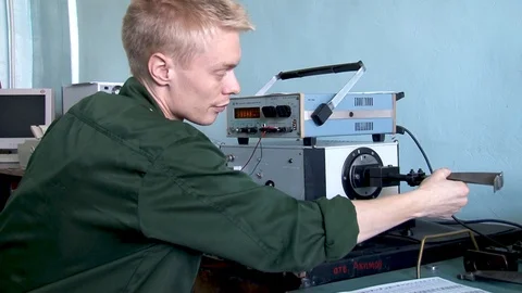 Selection of compressor working blades by weight moment using special equipment. Stock Footage 123209924