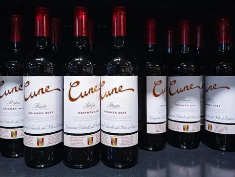 Selection of CUNE crianza red wine bottles displayed on a shelf in a store .. Stock Photos