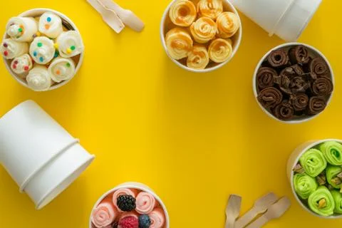 Selection of different rolled ice creams in cone cups Stock Photos