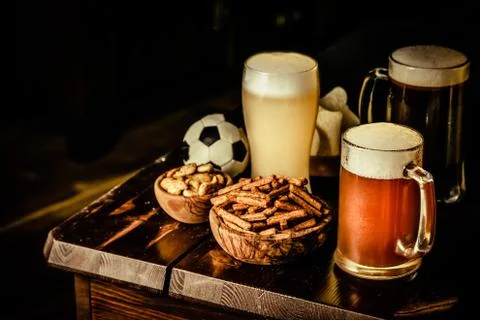 Selection of different types of beer and salty snacks s in pub Stock Photos
