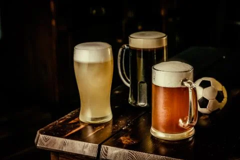 Selection of different types of beer in glasses in pub background Stock Photos