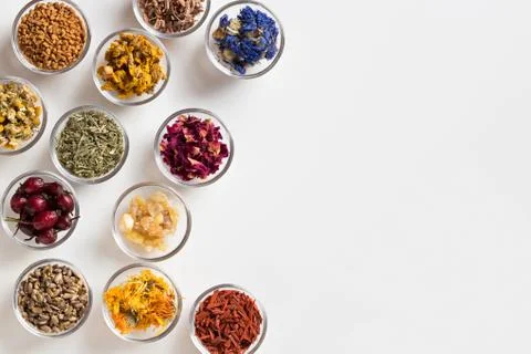 Selection of dried herbs on a white background with copy space, top view Foto stock