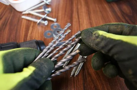 Selection of drills before starting work. Builder's work process Stock Photos